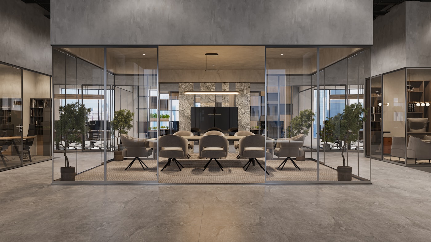 Quiet glass-walled meeting room with an empty table and chairs